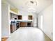 Functional kitchen with stainless steel fridge and lots of light at 5234 Melbourne Rd, Indianapolis, IN 46228