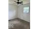Bedroom with neutral carpet, white walls, and natural light from one window at 5312 N Kercheval Dr, Indianapolis, IN 46226