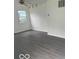 Bright living room featuring new flooring and a ceiling fan at 5312 N Kercheval Dr, Indianapolis, IN 46226