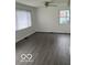 Bright living room featuring new flooring and natural light from two windows at 5312 N Kercheval Dr, Indianapolis, IN 46226