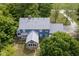 Aerial view of blue home with a gray roof surrounded by mature trees at 5538 N 700 W, McCordsville, IN 46055