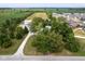 Expansive aerial view of a home with a long driveway, large outbuilding, mature trees and adjacent farmland at 5538 N 700 W, McCordsville, IN 46055