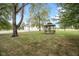 Spacious backyard featuring a large garage and gazebo, offering plenty of room for outdoor activities and entertaining at 5538 N 700 W, McCordsville, IN 46055