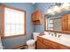 Bathroom features classic vanity, framed mirror, wood trim window and a shower tub combo at 5538 N 700 W, McCordsville, IN 46055
