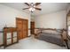 Bedroom boasts a ceiling fan, light carpet, and comfortable decor with good natural light at 5538 N 700 W, McCordsville, IN 46055