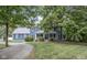 Charming two-story home with a well-manicured front yard and mature trees providing shade and curb appeal at 5538 N 700 W, McCordsville, IN 46055