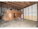 Large garage interior with a wooden structure inside and ample room to store equipment and vehicles at 5538 N 700 W, McCordsville, IN 46055