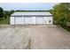 Large three-bay garage with ample parking space on a well-maintained property at 5538 N 700 W, McCordsville, IN 46055