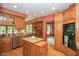 Kitchen offers custom cabinetry, granite countertops, stainless steel appliances, and a center island at 5538 N 700 W, McCordsville, IN 46055