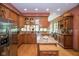 Well-equipped kitchen with stainless steel appliances, granite countertops, and ample cabinet space, perfect for cooking at 5538 N 700 W, McCordsville, IN 46055