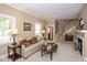 Comfortable living room showcases a fireplace, staircase, and views to the exterior, providing a serene setting at 5538 N 700 W, McCordsville, IN 46055