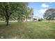 Picturesque property showcasing a gazebo, a large garage, mature trees, and a lush lawn at 5538 N 700 W, McCordsville, IN 46055
