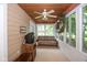 Bright sunroom with wood ceilings, a ceiling fan, neutral walls and carpeting, and large windows to let the light shine in at 5538 N 700 W, McCordsville, IN 46055