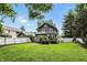 Stunning backyard with a large, well-manicured lawn and mature trees, creating a peaceful and inviting outdoor space at 5922 Broadway St, Indianapolis, IN 46220