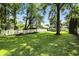 Spacious backyard with a picnic table area, a white fence, and plenty of green space at 5922 Broadway St, Indianapolis, IN 46220