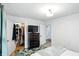 Bedroom featuring a closet, TV, and comfortable sleeping area at 5922 Broadway St, Indianapolis, IN 46220