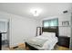Bright bedroom with hardwood floors and ample natural light at 5922 Broadway St, Indianapolis, IN 46220