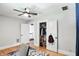 Bedroom with hardwood floors and a closet with shelving for organized storage at 5922 Broadway St, Indianapolis, IN 46220