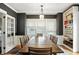 Inviting dining room with a wooden table, decorative lighting, and built-in shelving at 5922 Broadway St, Indianapolis, IN 46220