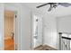 Hallway features hardwood floors and leads to multiple rooms at 5922 Broadway St, Indianapolis, IN 46220