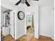 Hallway features wood floors and leads to other rooms in the home at 5922 Broadway St, Indianapolis, IN 46220