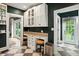 Chic kitchen area with white cabinetry, granite countertops, and barstool seating at 5922 Broadway St, Indianapolis, IN 46220