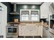 Charming kitchen features stainless steel appliances and a farmhouse sink at 5922 Broadway St, Indianapolis, IN 46220