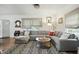 Inviting living room with hardwood floors, a generous sectional sofa, and ample natural light at 5922 Broadway St, Indianapolis, IN 46220