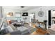 Cozy living room with hardwood floors, a comfortable gray sectional, and plenty of natural light at 5922 Broadway St, Indianapolis, IN 46220