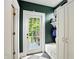 Mud room features a door leading to the exterior and a bench with storage at 5922 Broadway St, Indianapolis, IN 46220