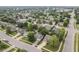 An aerial view of a neighborhood showcases well-maintained homes and lush green landscaping at 5986 Regency Dr, Columbus, IN 47203