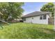 Spacious backyard featuring mature trees, a patio, playground, and well-maintained lawn for outdoor activities at 5986 Regency Dr, Columbus, IN 47203