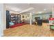 Finished basement with seating area, entertainment space, and laminate flooring at 5986 Regency Dr, Columbus, IN 47203