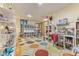 Open basement space with a study area, bright lighting, and custom shelving at 5986 Regency Dr, Columbus, IN 47203