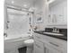 Stylish bathroom featuring subway tile, a glass-enclosed shower, and a modern vanity at 5986 Regency Dr, Columbus, IN 47203