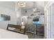 Dining area adjacent to the living room, featuring a modern chandelier and views of the backyard at 5986 Regency Dr, Columbus, IN 47203