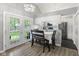 Bright dining area with white cabinets, stainless steel appliances, and access to the backyard at 5986 Regency Dr, Columbus, IN 47203