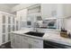Bright kitchen features marble countertops, white cabinetry, and an undermount sink at 5986 Regency Dr, Columbus, IN 47203