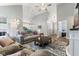 Open-concept living room with vaulted ceilings, ceiling fan, and neutral color palette at 5986 Regency Dr, Columbus, IN 47203