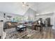 Spacious living room with vaulted ceiling, lots of light, and view into the kitchen at 5986 Regency Dr, Columbus, IN 47203