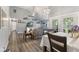 Open-concept living and dining area featuring hardwood floors and access to the backyard at 5986 Regency Dr, Columbus, IN 47203