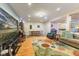 Spacious living room featuring a dining area, comfortable seating, entertainment center and colorful rug at 5986 Regency Dr, Columbus, IN 47203