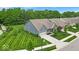 Overhead view of a well-maintained home with a manicured lawn and mature trees at 6536 Apperson Dr, Noblesville, IN 46060