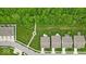 A beautiful aerial view showcasing several homes with manicured lawns and a lush tree line in the background at 6536 Apperson Dr, Noblesville, IN 46060