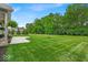 Expansive backyard with manicured lawn and mature trees, creating a serene outdoor setting at 6536 Apperson Dr, Noblesville, IN 46060
