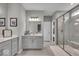 A spacious bathroom with double sinks, large mirror, tile floors, and a walk-in shower at 6536 Apperson Dr, Noblesville, IN 46060