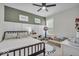 Charming bedroom with a comfortable bed, a bright window, and neutral decor at 6536 Apperson Dr, Noblesville, IN 46060