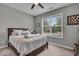 Cozy bedroom with a comfortable bed, bright window, carpet flooring, and neutral walls at 6536 Apperson Dr, Noblesville, IN 46060