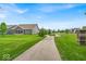 Landscaped street view leading to a home community at 6536 Apperson Dr, Noblesville, IN 46060