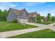 Beautifully landscaped home with an attached two car garage, and a manicured front lawn at 6536 Apperson Dr, Noblesville, IN 46060